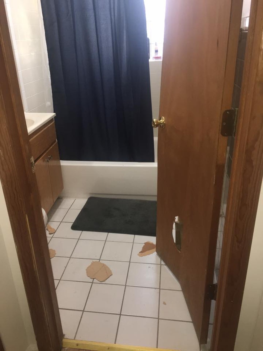 The student tried to lock himself in his bathroom, but the burglars were able to break in the door.