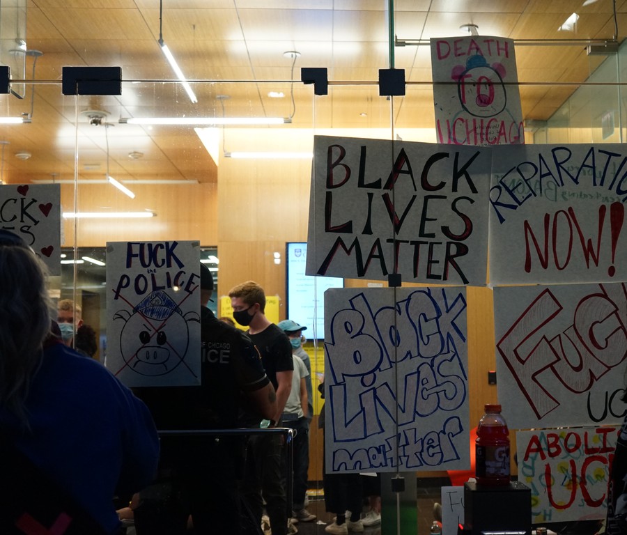 Protesters with #CareNotCops stage a sit-in in the lobby of the UCPD headquarters.